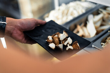 Mushrooms in the black plate have a restaurant.