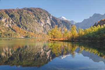 A clear autumn day at Lake Almsee in Upper Austria's part of the Salzkammergut in the Almtal valley.