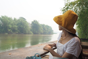 Woman and river at Huk ping, Kampangpetch, Thailand.