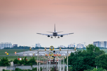 Passenger plane over the runway