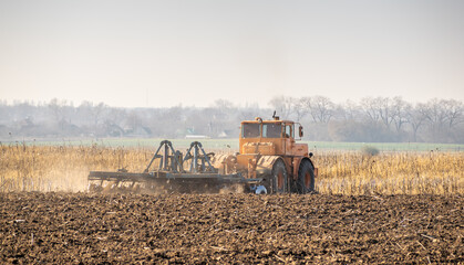 Tractor cultivating field