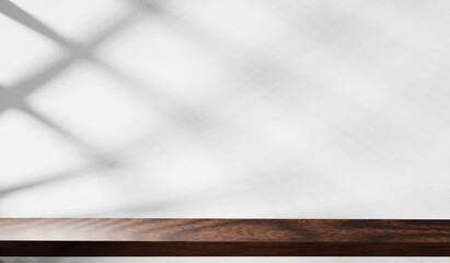 Wood table top with shadow on white wall background. For montage product display.