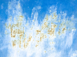Rust stains on an old blue metal surface