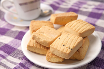 Fototapeta na wymiar Close up of cookies and tea on table 