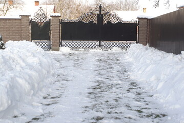 yard with snow clearing in winter 