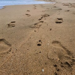 Fototapeta na wymiar Beach footsteps.