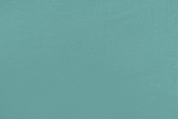Turquoise homogeneous background with a textured surface