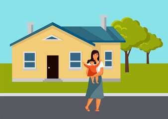 The mother stands with a small child in her arms. Parent and daughter are on the street at the house, natural landscape. The girl happily raises her hands. Mom is taking care of the baby uotdoor