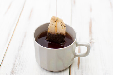 Tea in a cup with a disposable bag.