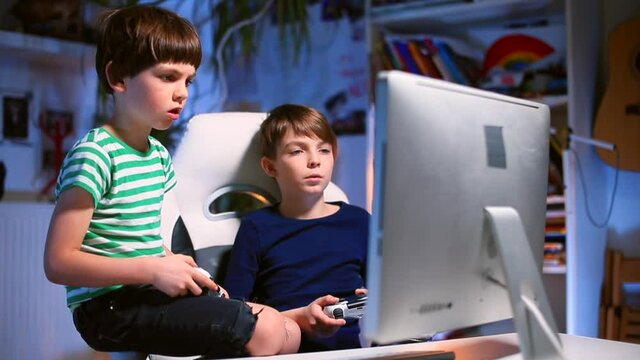 Expressing the emotions of a teenager in a team video game. He moves his body, uses a joystick while sitting on a chair. Try to complete the task. Free time in room.