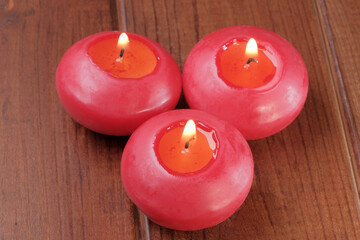Three red small round candles