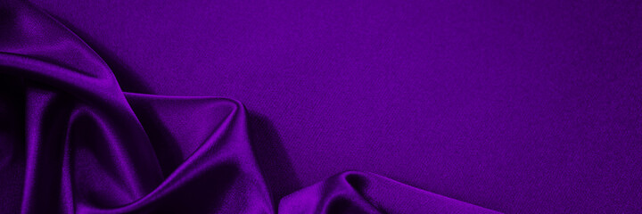 Black blue purple silk satin background. Copy space for text or product. Wavy soft folds on shiny...