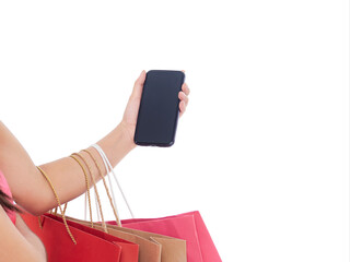 Woman holding smartphone with shopping bags