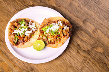 Roast tacos with corn tortillas. Mexican tacos. traditional mexican food concept on wooden table.