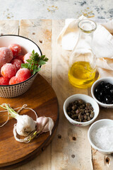 Some ingredients to make puttanesca pasta, a typical italin dish