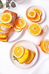 Pieces of fresh homemade baked sliced lemon cake on the white plate