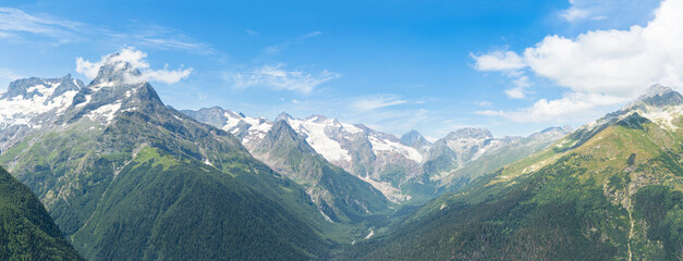 Mountain panorama .Panorama of the mountain range and valley below the blue sky to the horizon