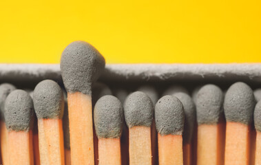 Box with matches on color background, closeup