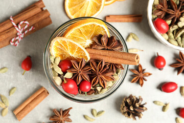 Aroma potpourri with different spices on white table, flat lay