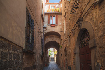 A charming old town lane in the Etruscan hilltop village of Orvieto, Umbria in Italy.