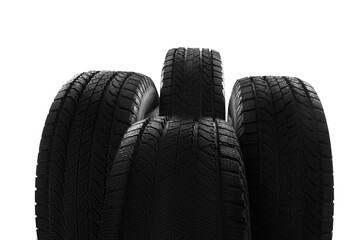 Set of new winter tires on white background, closeup