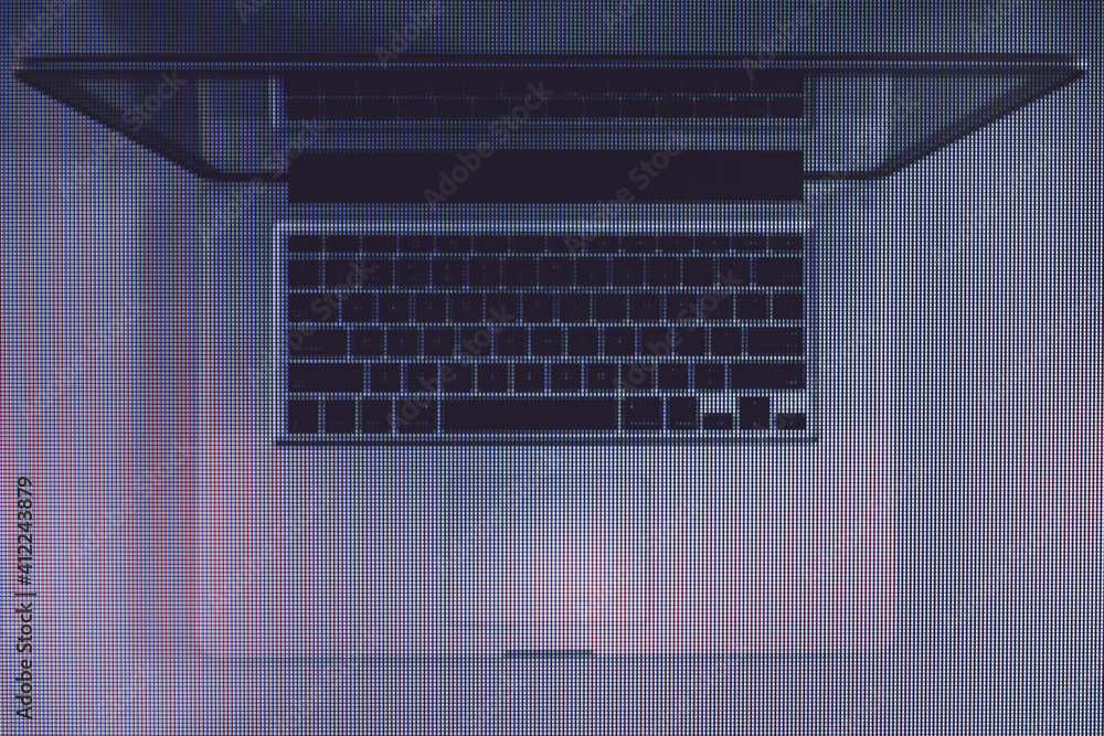 Poster beautiful silver laptop in the color light on a table and night background. macro photography view. 