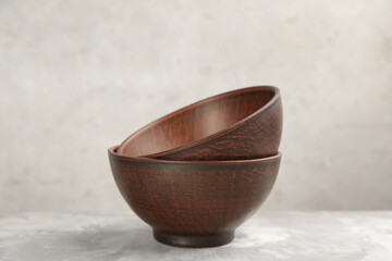 Stylish handmade clay bowls on grey table