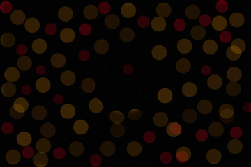 Yellow bokeh on a black background. Glare to decorate the photo. Photo decoration element.