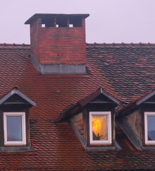 An old european house with a light on