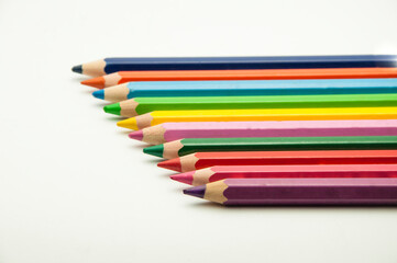 colored pencils on a white background. education concept. illustration of training.