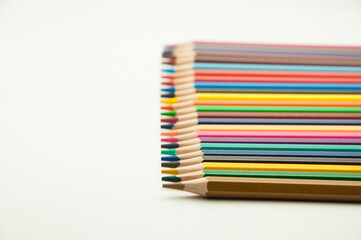 colored pencils on a white background. education concept. illustration of training.