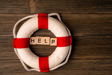 A lifebuoy next to the letters 