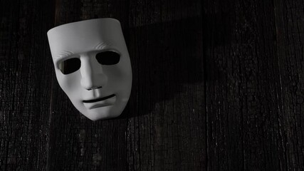 Facial expressions and emotions in the movement of light on the theatrical mask. Theatrical concept