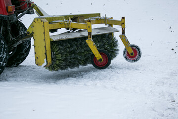Snowplow removing snow on street after blizzard. Snowplow vehicle clears snowy road during...
