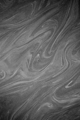 black laminated plastic with white streaks abstract background plane without people vertical image