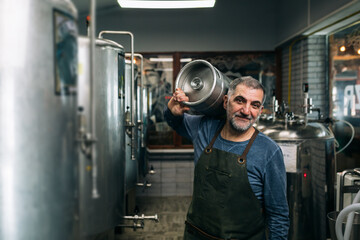 brewer working in his craft beer brewery