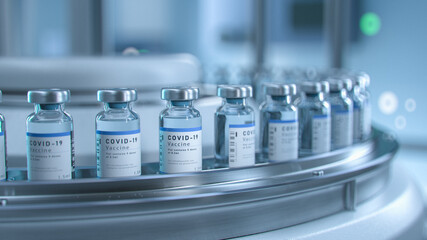 SARS-COV-2 COVID-19 Coronavirus Vaccine Mass Production in Laboratory, Bottles with Branded Labels Move on Pharmaceutical Conveyor Belt in Research Lab. Medicine Against SARS-CoV-2.