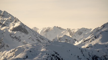 view to the alps, the hohe tauern  in austria, with sahara dust in the athmosphere on a sunny winter day
