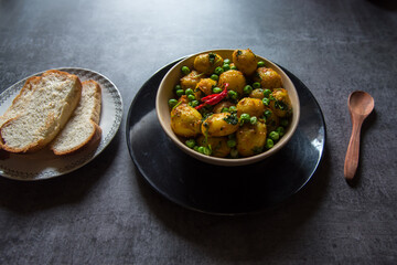 Aloo dum or steamed potatoes in gravy in a bowl. A popular food item across north and eastern India. 