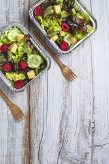 Healthy vegan take away salad in aluminum container