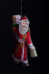 Christmas decorations for the tree on a black background. Santa Claus Father Christmas 