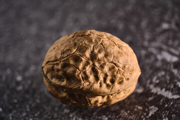Walnut close up macro on black background.