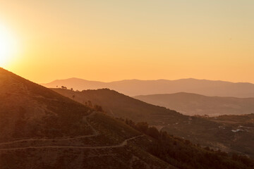 Panoramic view of hills at sunset