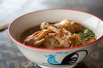 Hot chicken noodle in white bowl, Street food of Thailand.