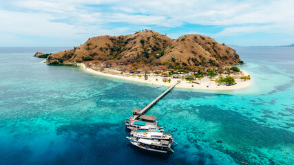 Aerial view of Kanawa Island in Komodo National Park, Labuan Bajo, Indonesia. Beautiful island with resort and wooden pier