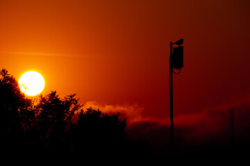 late afternoon the sun going out tomorrow is a new day