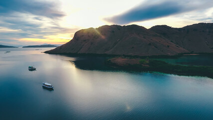 Aerial view of calm sea with sailing boat in Kalong Island, Komodo National Park, Labuan Bajo, Indonesia