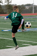 Athletic boy making amazing plays during a soccer game