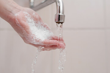 Hygiene. Cleaning Hands. Washing hands on sink.