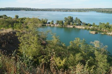 Fototapeta premium A beautiful flooded granite quarry near the Dnieper river. The village of Staryye kodaki.